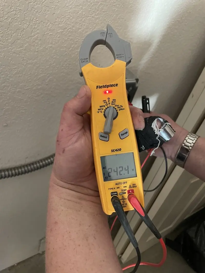 Voltage testing with clamp meter during Circuit Breaker Repair in Proctor
